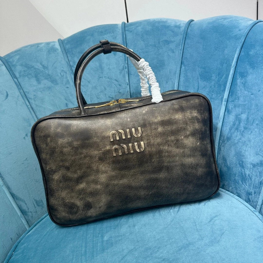 Miu Miu Bag Top version 【Level Surrogate Shopping】Miu New Bowling Bag Imported Calfskin Large Capacity Men's and Women's Same Casual Fashion Commuter Handbag Briefbag Shoulder Messenger Bag