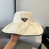 PRADA Hat Triangle mark logo Fisherman Hat Casual Sun Protection Plain Face Covering Sunshade Outdoor UV Protection Versatile Flat Top Bucket Hat